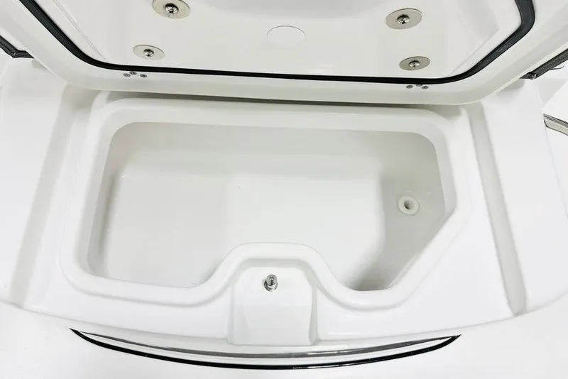 Slide: The Image of Open storage compartment on 2026 Sportsman Heritage 261 Center Console boat. - 13