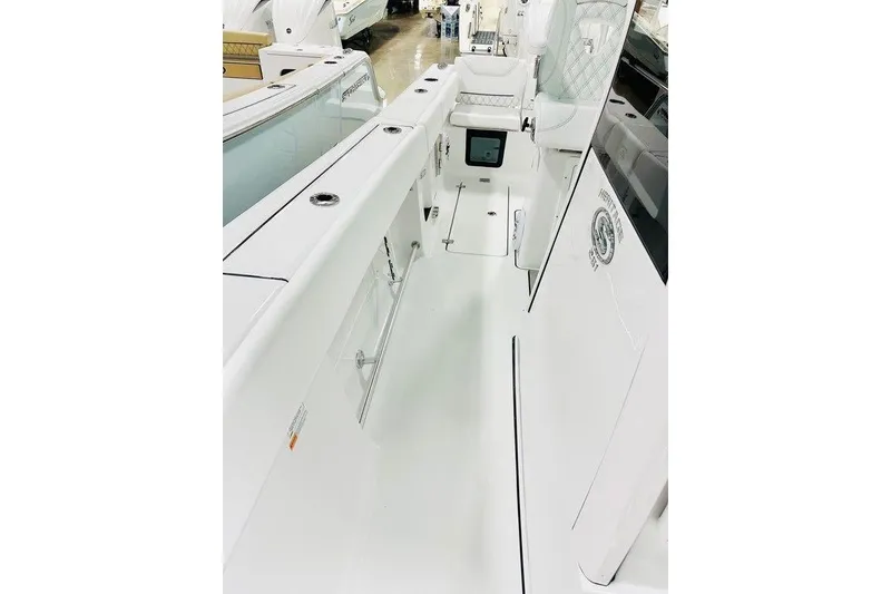 Slide: The Image of 2026 Sportsman Heritage 261 Center Console interior, showcasing sleek white design and modern features. - 14