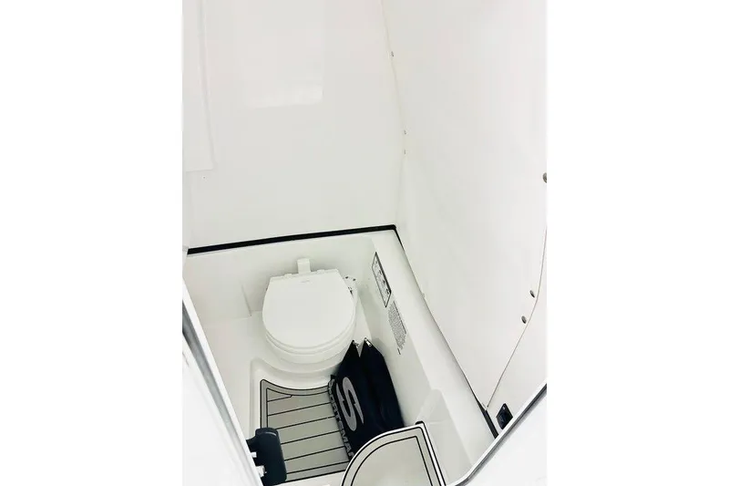 Slide: The Image of 2026 Sportsman Heritage 261 Center Console interior with marine toilet. - 9