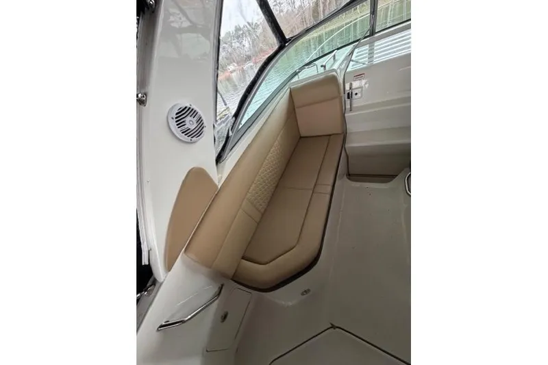 Slide: The Image of Interior seating of 2018 Sea Ray Sundancer 260 boat with beige upholstery. - 10