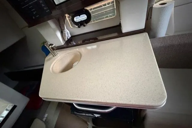 Slide: The Image of Interior of 2018 Sea Ray Sundancer 260 with compact sink and countertop. - 15
