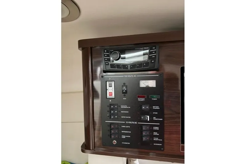 Slide: The Image of Control panel and stereo system in 2018 Sea Ray Sundancer 260 boat. - 18