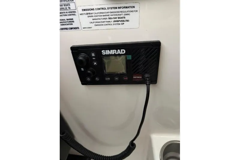 Slide: The Image of Simrad marine radio on 2018 Sea Ray Sundancer 260 boat dashboard. - 21