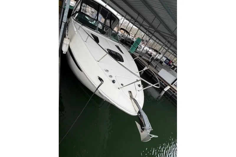 Slide: The Image of 2018 Sea Ray Sundancer 260 docked in a covered marina. - 3
