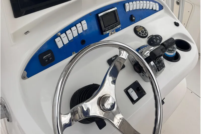 Slide: The Image of Helm console of a 2007 Boston Whaler 320 Outrage boat. - 10