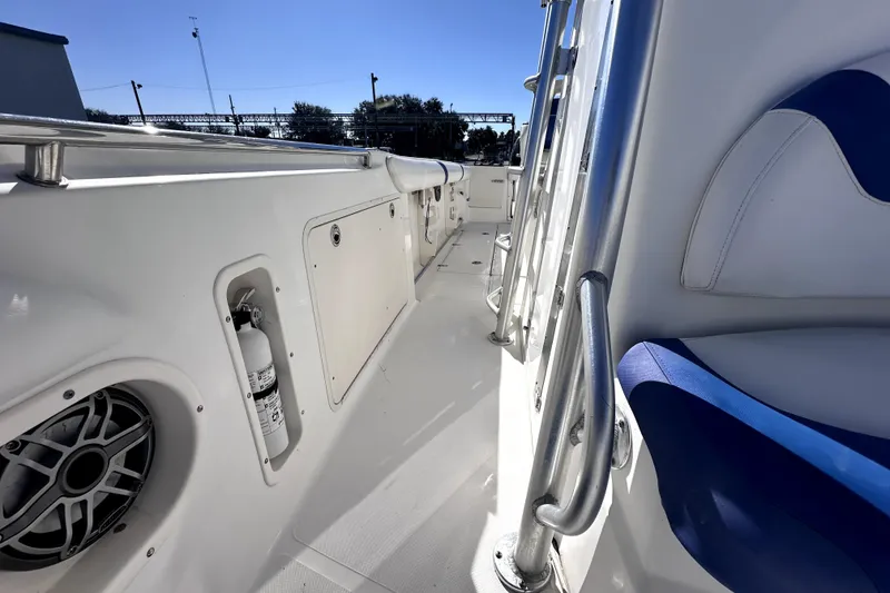 Slide: The Image of 2007 Boston Whaler 320 Outrage boat interior with seating and safety equipment. - 13