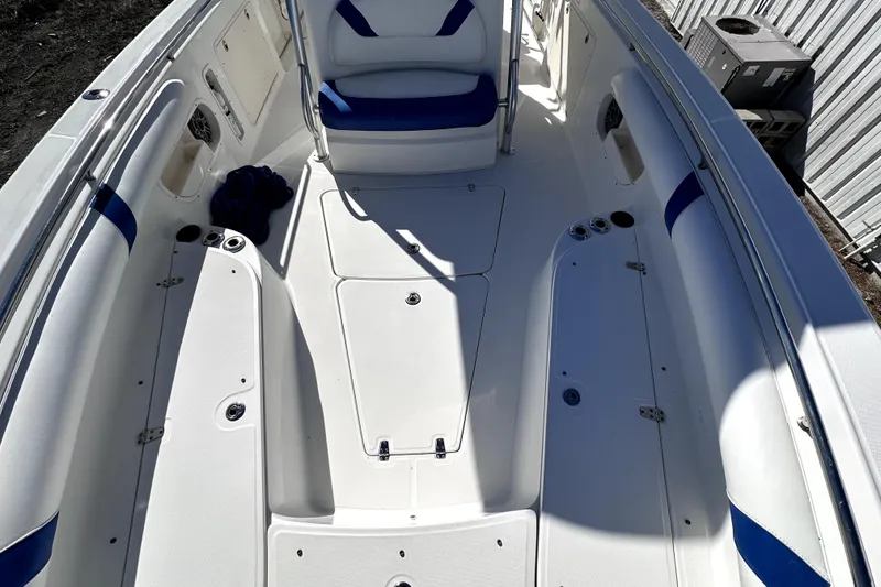 Slide: The Image of 2007 Boston Whaler 320 Outrage boat interior with white and blue seating. - 15