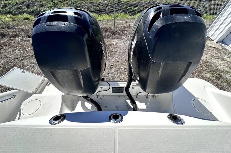 Slide: The Image of 2007 Boston Whaler 320 Outrage with dual outboard engines, rear view. - 26