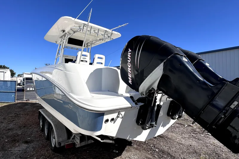 Slide: The Image of 2007 Boston Whaler 320 Outrage boat with dual Mercury engines on a trailer. - 4