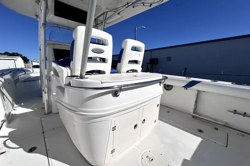 Slide: The Image of 2007 Boston Whaler 320 Outrage boat interior with seating and storage compartments. - 6