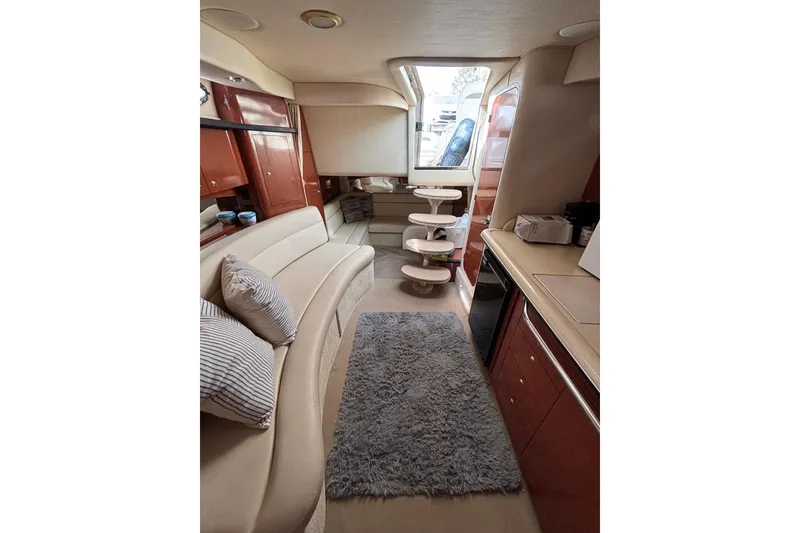 Slide: The Image of Luxurious interior of 2003 Sea Ray 340 Sundancer yacht with plush seating and modern amenities. - 17