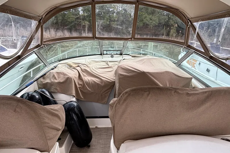 Slide: The Image of Interior view of a 2003 Sea Ray 340 Sundancer boat with covered seating. - 23