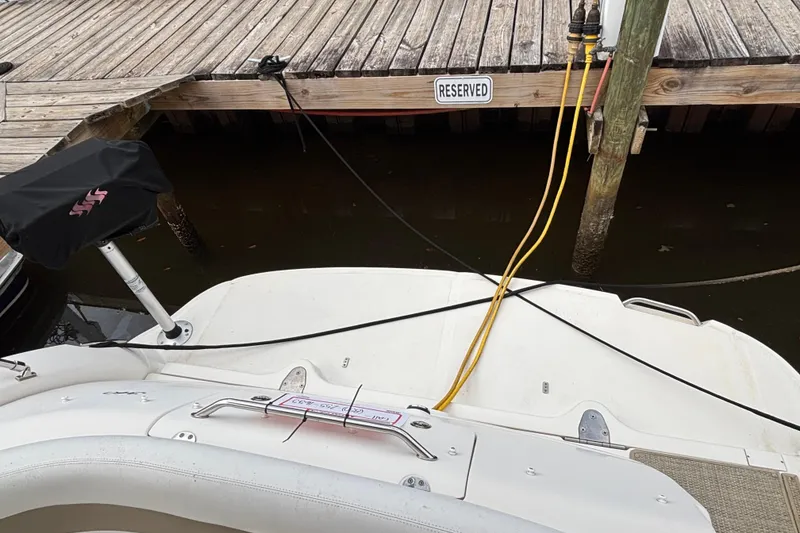 Slide: The Image of 2003 Sea Ray 340 Sundancer docked at reserved marina slip with power cables connected. - 6