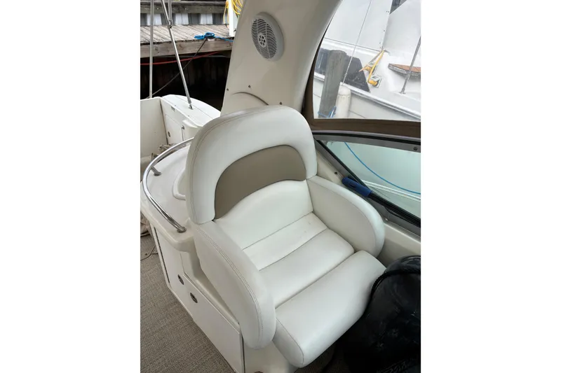 Slide: The Image of White leather seat on 2003 Sea Ray 340 Sundancer boat, docked. - 7