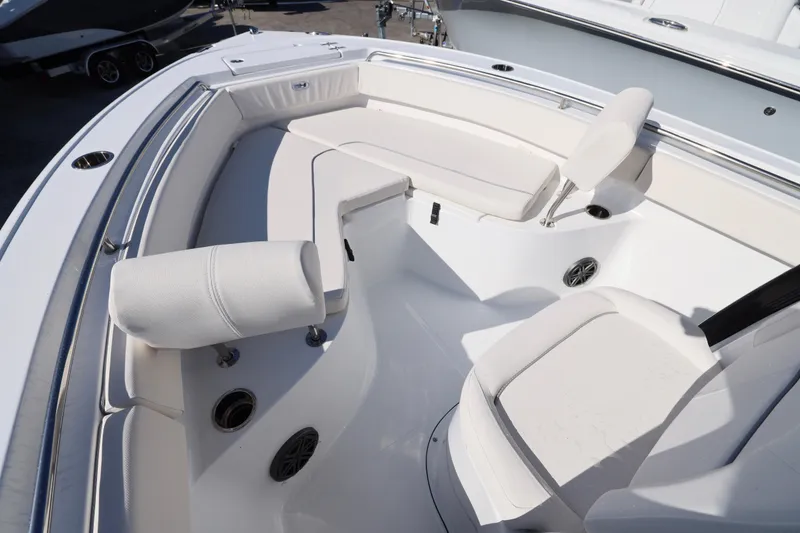 Slide: The Image of 2026 Sea Hunt Ultra 219 boat interior with white seating and modern design. - 12