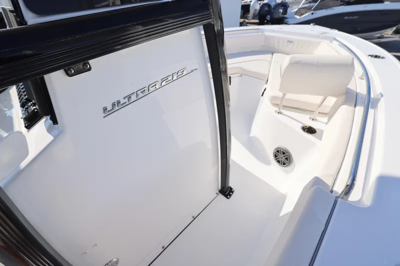 Slide: The Image of 2026 Sea Hunt Ultra 219 boat interior with seating and speaker detail. - 16