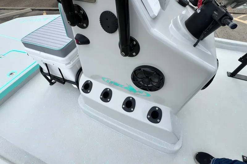 Slide: The Image of Cayuco Boats Lynx 18, 2026 model, featuring a sleek console and seating area. - 12