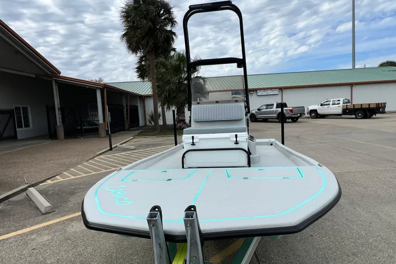 Slide: The Image of 2026 Cayuco Boats Lynx 18 in parking lot, showcasing sleek design and modern features. - 6