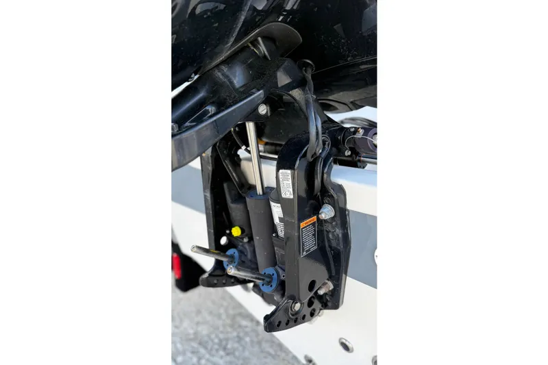 Slide: The Image of Close-up of 2023 Tidewater 220 LXF boat engine mount and hydraulic system. - 11