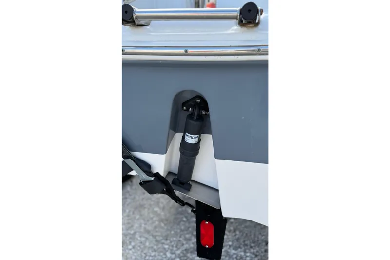 Slide: The Image of 2023 Tidewater 220 LXF boat transom with trim tab and hydraulic system. - 13