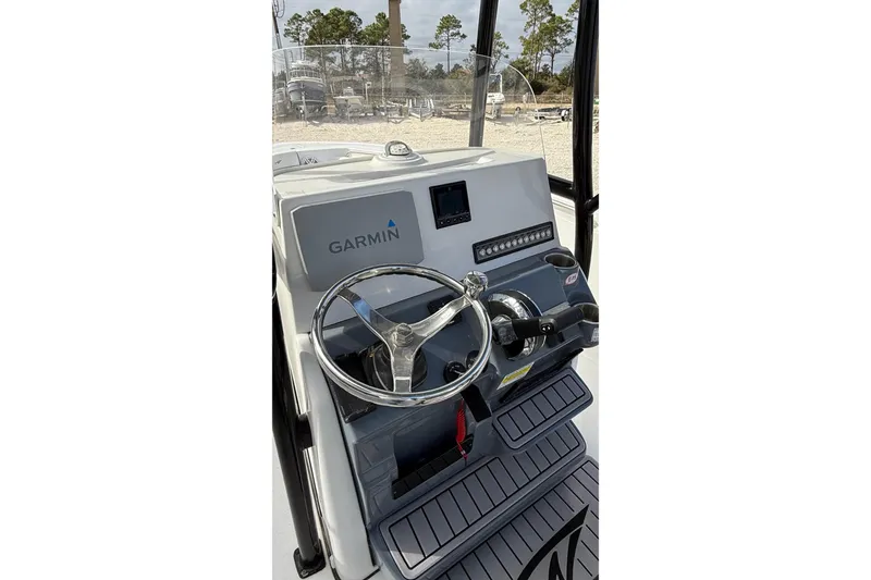 Slide: The Image of 2023 Tidewater 220 LXF boat dashboard with Garmin navigation system. - 20