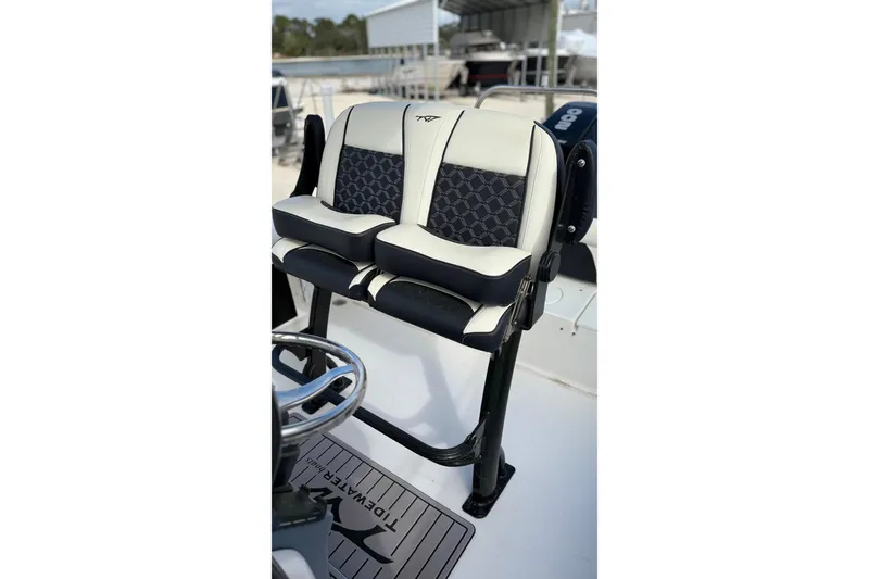 Slide: The Image of 2023 Tidewater 220 LXF boat seating with stylish black and white upholstery. - 27
