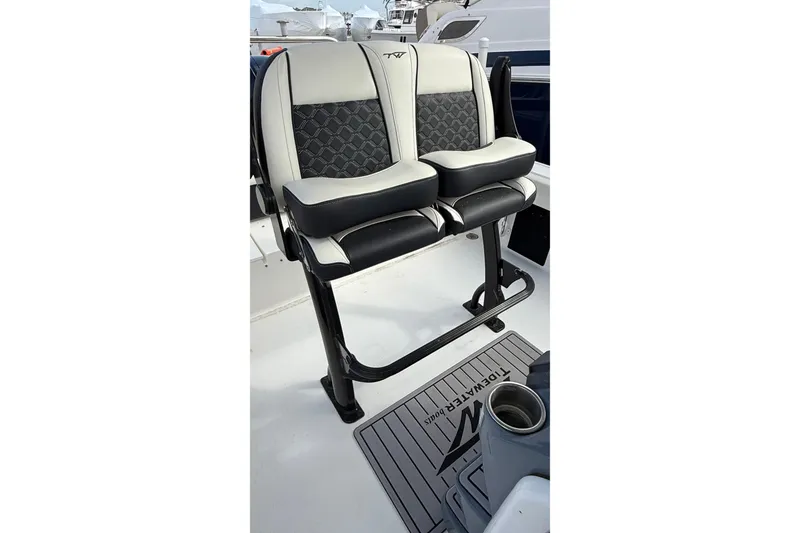 Slide: The Image of 2023 Tidewater 220 LXF boat seats with stylish black and white design. - 28