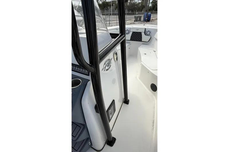 Slide: The Image of 2023 Tidewater 220 LXF boat interior with seating and console details. - 30