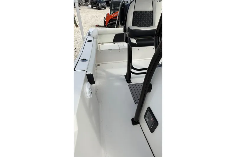 Slide: The Image of 2023 Tidewater 220 LXF boat interior with seating and console details. - 31