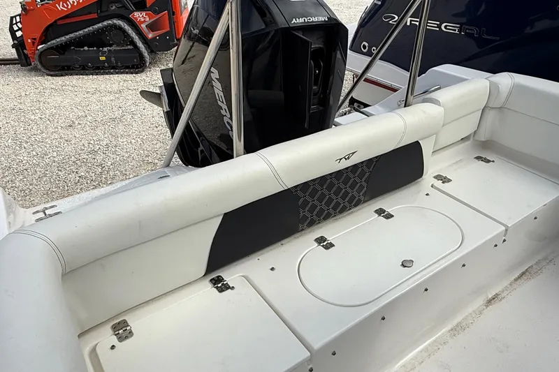 Slide: The Image of 2023 Tidewater 220 LXF boat interior with seating and Mercury engine. - 33