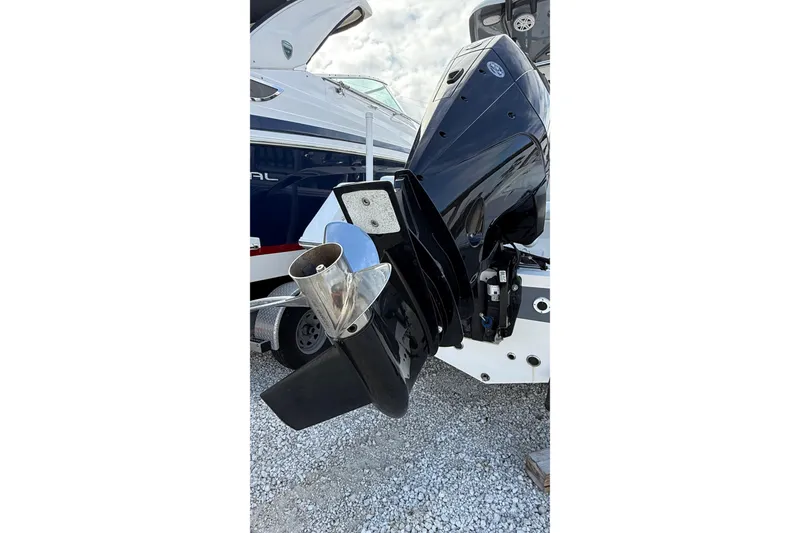 Slide: The Image of 2023 Tidewater 220 LXF boat engine with propeller, displayed on gravel surface. - 8