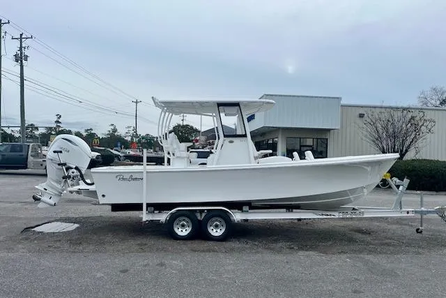 The Image of 2026 Pair Customs 24 Center Console MV boat on trailer, parked outdoors. - 1