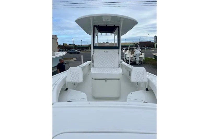 Slide: The Image of 2026 Pair Customs 24 Center Console MV boat with white seating and spacious deck. - 3