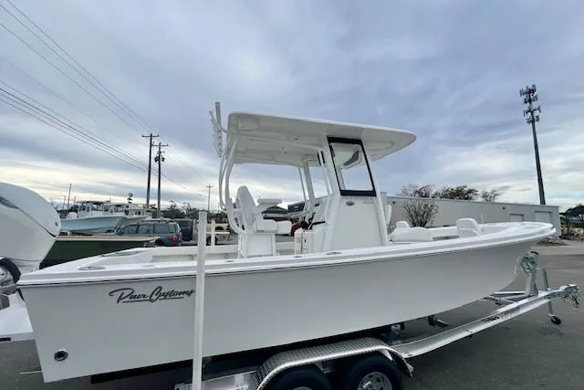 Slide: The Image of 2026 Pair Customs 24 Center Console MV boat on trailer, side view. - 4