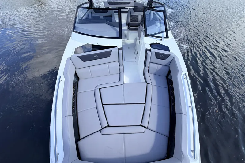 Slide: The Image of 2026 Cobalt R35 Outboard boat with spacious seating on calm water. - 16