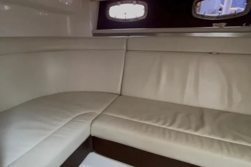 Slide: The Image of Interior seating of 2013 Chaparral 327 SSX boat with beige upholstery. - 10