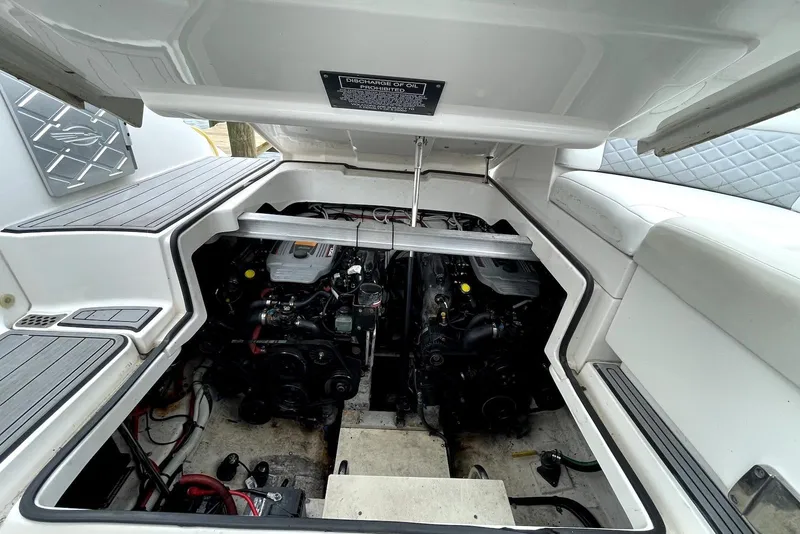 Slide: The Image of Engine compartment of 2013 Chaparral 327 SSX boat, showcasing dual engines and clean layout. - 13