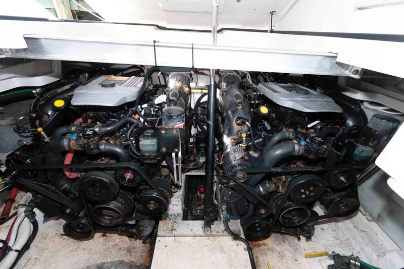 Slide: The Image of Engine compartment of a 2013 Chaparral 327 SSX boat, showcasing dual engines. - 18