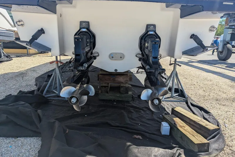 Slide: The Image of Rear view of 2013 Chaparral 327 SSX boat with dual propellers on stands. - 24