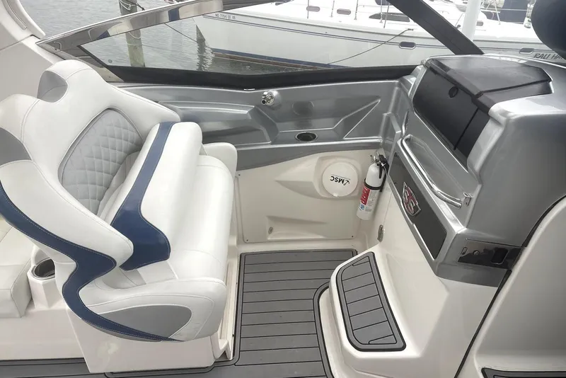 Slide: The Image of Interior of 2013 Chaparral 327 SSX boat with white and blue seating. - 6