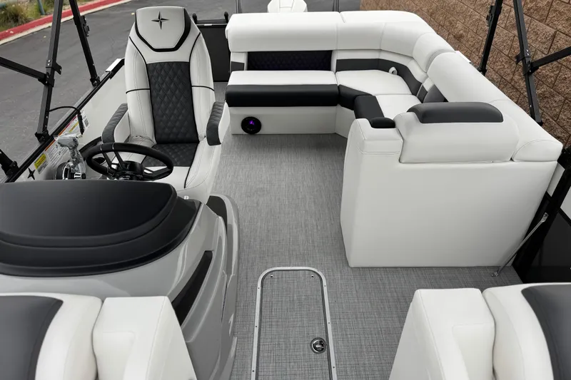 Slide: The Image of 2026 Berkshire 21CL STS boat interior with luxurious seating and modern steering console. - 16