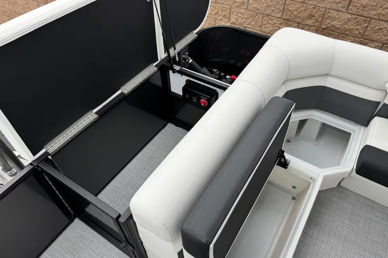 Slide: The Image of 2026 Berkshire 21CL STS boat interior with storage compartments and seating. - 21