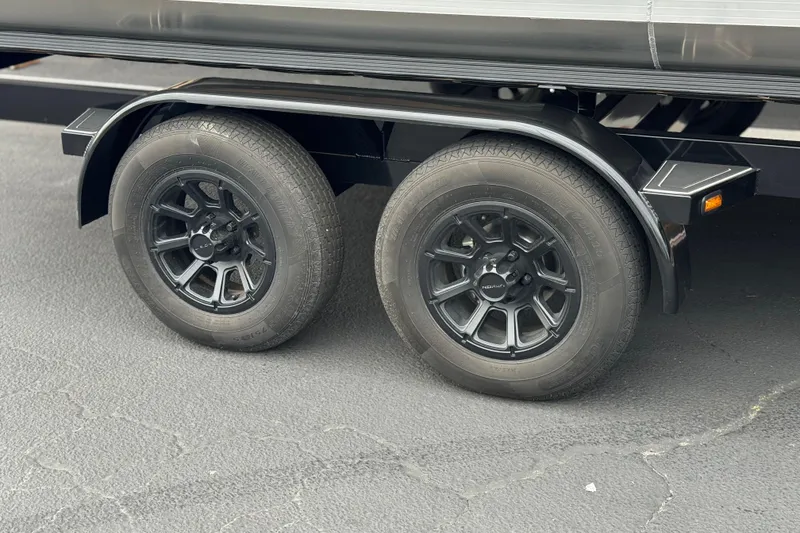 Slide: The Image of 2026 Berkshire 21CL STS trailer wheels on asphalt surface. - 32