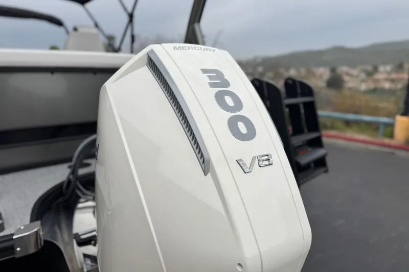 Slide: The Image of Mercury 300 V8 engine on 2026 Berkshire 21CL STS boat, outdoor setting. - 8