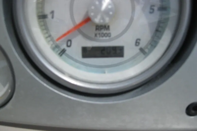 Slide: The Image of 2005 Maxum 1900 SR3 boat dashboard with gauges and steering wheel. - 17