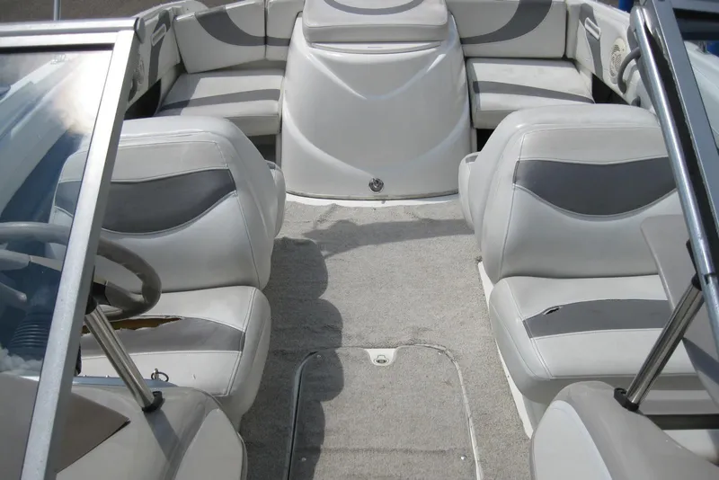Slide: The Image of 2005 Maxum 1900 SR3 boat interior with cushioned seating and carpeted flooring. - 19