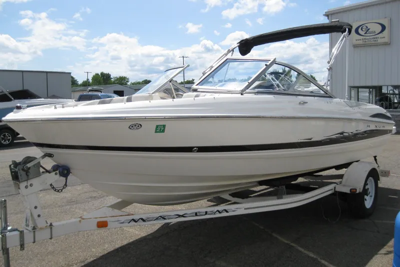 Slide: The Image of 2005 Maxum 1900 SR3 boat with MerCruiser outdrive, parked on concrete surface. - 7