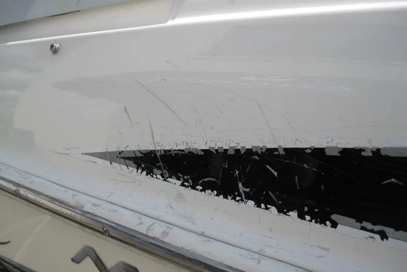 Slide: The Image of 2005 Maxum 1900 SR3 boat on trailer, parked outdoors under a clear sky. - 8