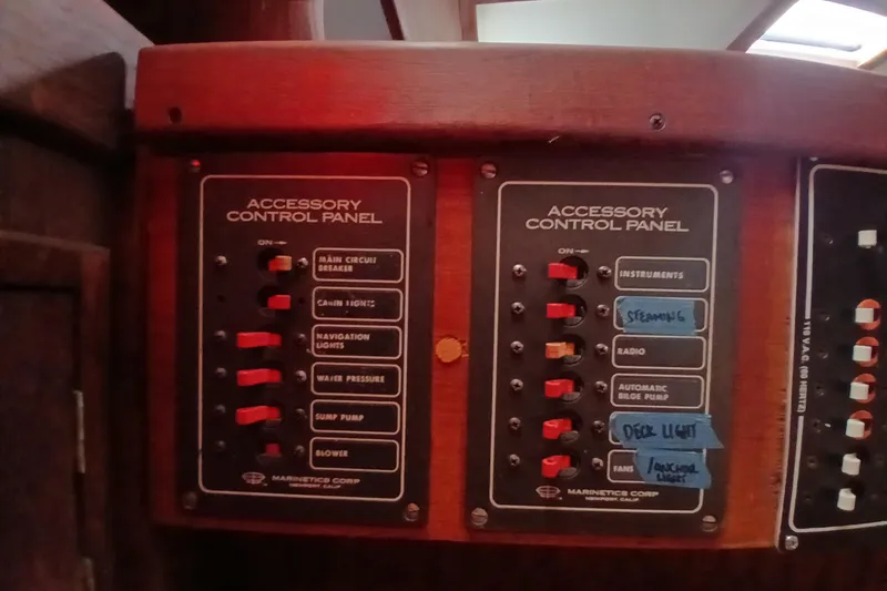 Slide: The Image of 1977 Tartan 37 accessory control panel with labeled switches and circuit breakers. - 24