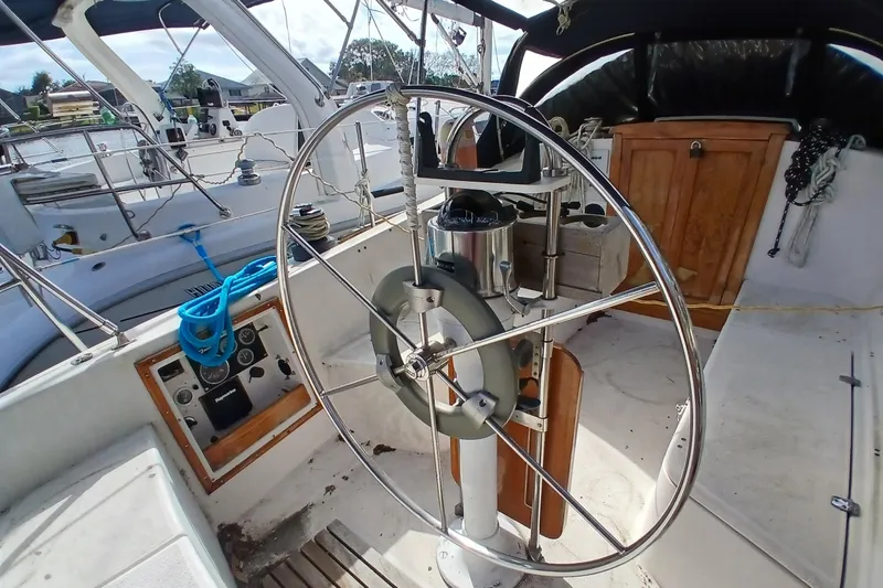 Slide: The Image of Cockpit of a 1977 Tartan 37 sailboat with steering wheel and navigation equipment. - 29